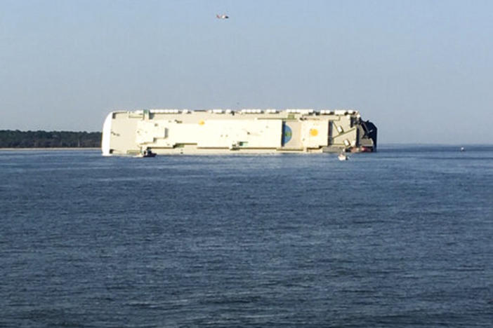 A capsized cargo ship is seen near a port on the Georgia coast, Sunday, Sept. 8, 2019. 
