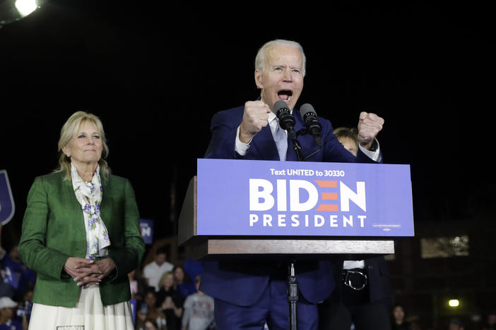 Democratic presidential candidate former Vice President Joe Biden, right, speaks next to his wife Jill during a primary election night rally Tuesday, March 3, 2020, in Los Angeles.