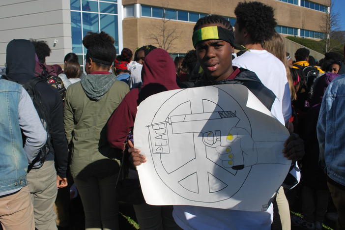 Rashawn Collins, a student at Maynard Holbrook Jackson High School in Atlanta, protests gun violence after walking out of school with hundreds of classmates.