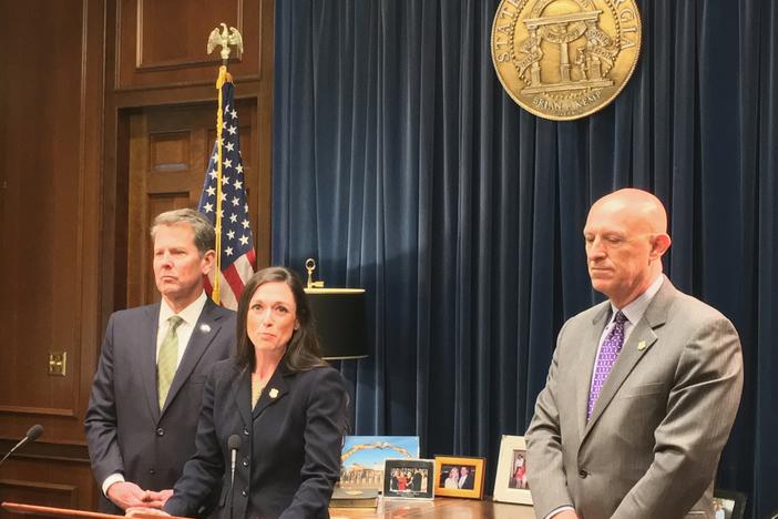 Jaret Usher will lead the state's new anti-gang task force at the Georgia Bureau of Investigation. Also present are Gov. Brian Kemp (left) and GBI Director Vic Reynolds (right).