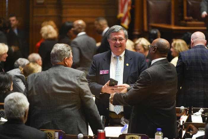 Georgia State House Rep. Rick Jasperse talks with colleagues during the first day of the year for the general session of the state legislature, Monday, Jan. 13, 2020 in Atlanta. 