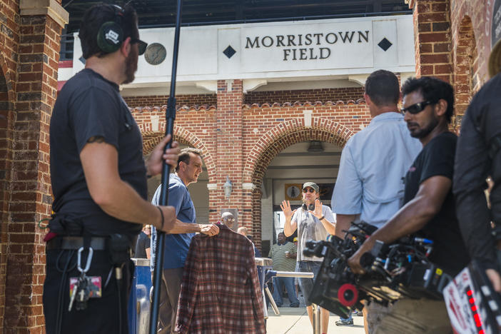 Hank Azaria, second from left, takes direction before filming a scene in his new television show Brockmire at Luther Williams Field, rebadged as Morristown Field, in Macon, Ga. 