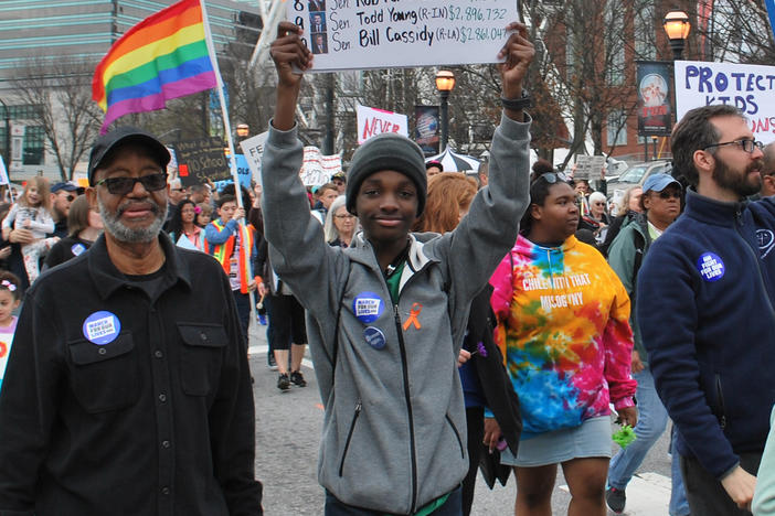 Sixteen-year-old Niles Francis, a student at South Cobb High School, marched with grandfather, Jerry Pennick. Francis is lobbying the Georgia General Assembly to pass SB 457, a school safety bill requiring more active shooter drills. 