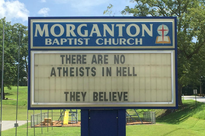 A sign in front of the Morganton Baptist Church reads, "There are no atheists in hell. They believe."
