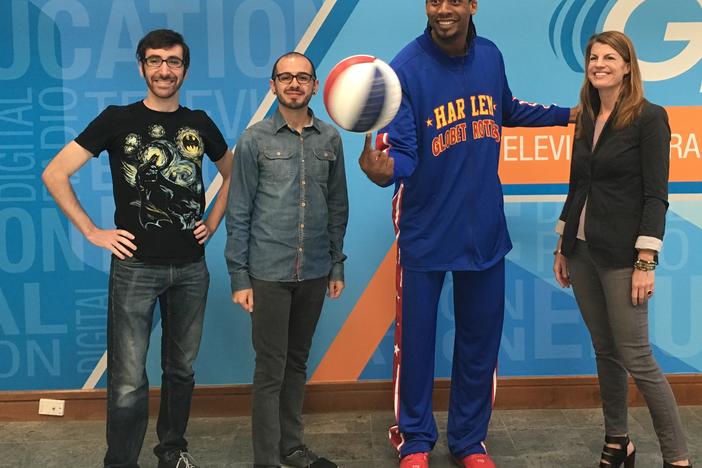 SCAD students Scott Kalison and Carlos Soler, Harlem Globetrotter Moose Weekes,  and Lee Todd, who oversees special projects at SCAD.