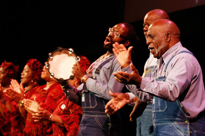 Freddie Palmer, right, leads the McIntosh County Shouters during a recent performance at the Lucas Theatre in Savannah. 