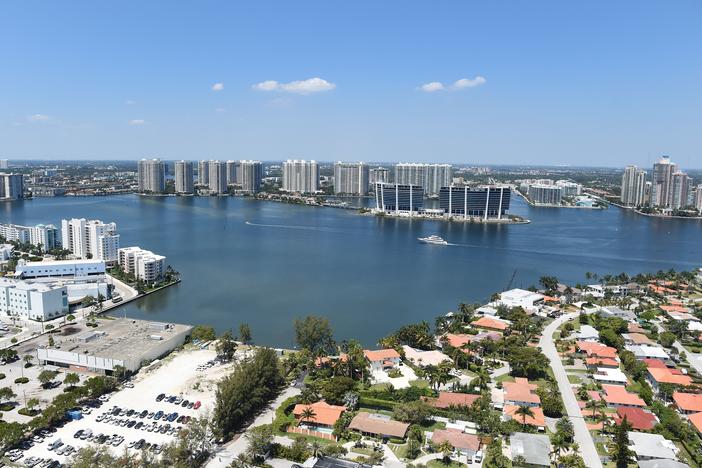 A new study has found that home sale prices and volume appear to be declining in Florida coastal areas at vulnerable-to-rising sea levels compared to coastal areas with less risk. Here, the balcony view from a luxury condo in Sunny Isles Beach, Fla., in 2017.
