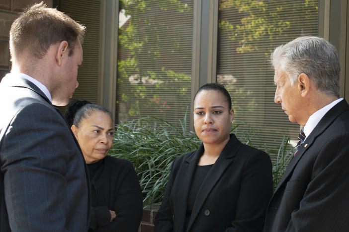 Rulennis Munoz (center right) outside Lancaster Courthouse Oct. 14, after learning that the police officer who fatally shot her brother had been cleared of criminal wrongdoing by the Lancaster County District Attorney. Her mother, Miguelina Peña, and her attorney Michael Perna (far right) stood by.