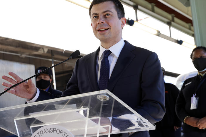 U.S. Secretary of Transportation Pete Buttigieg speaks to Amtrak employees Feb. 5 during a visit at Union Station in Washington, D.C. In a Thursday interview with NPR's <em>Morning Edition</em>, he said not making infrastructure investment would be a "threat to American competitiveness."