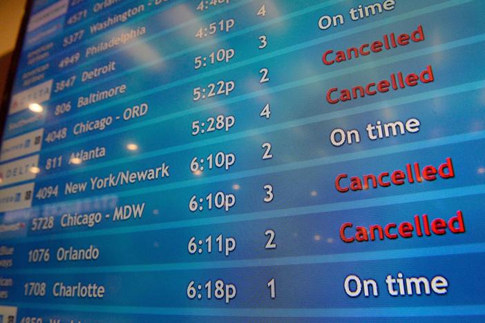 A screen shows canceled incoming flights at T.F. Green International Airport in Warwick, R.I., on March 30, 2020. Consumer advocates and two senators say airlines are sitting on nearly $15 billion in refunds owed to customers for canceled travel.