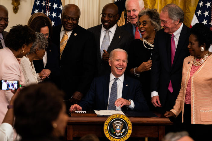 President Joe Biden is joined by Vice President Kamala Harris and members of Congress at the signing the Juneteenth National Independence Day Act into law in the East Room of the White House on June 17, 2021.