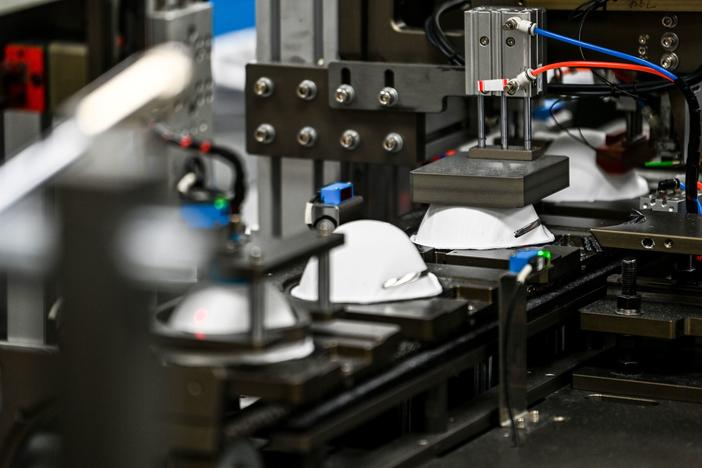 A machine makes masks in a medical-equipment factory in the U.S. on Feb. 15. When an N95 respirator shortage left hospitals scrambling in 2020, U.S. manufacturers stepped in. Now, some of those companies are struggling to sell their masks.