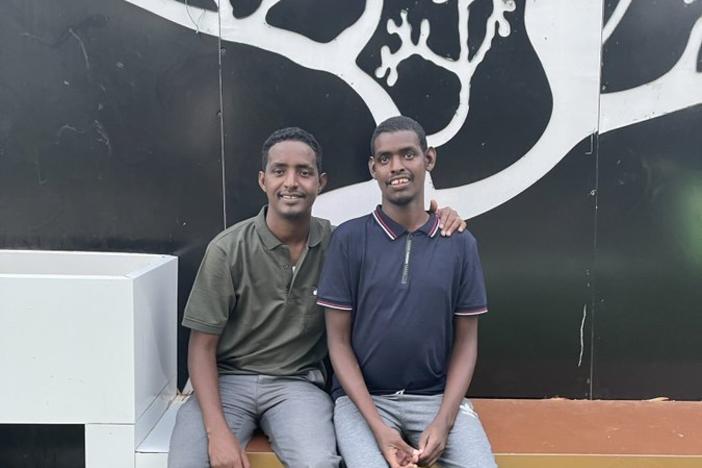 Omar Mohamed, left, and his brother, Hassan. In the graphic memoir he coauthored, <em>When Stars Are Scattered, </em>Mohamed shares what their life was like in the refugee camps in Kenya — and their journey to resettlement in the U.S.