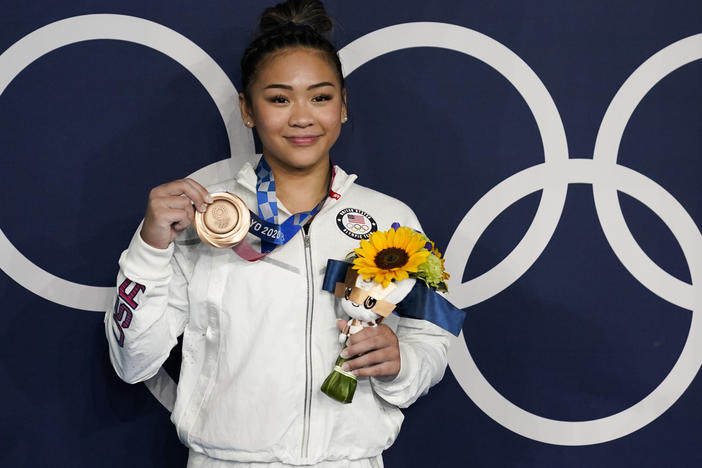 U.S. gymnast Sunisa Lee took home a bronze medal for her performance on the uneven bars at the Tokyo Olympics, as well as a gold medal in the women's all-around.