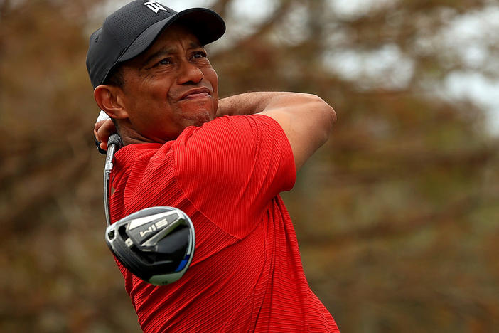 Tiger Woods, pictured in December 2020, posted a video on Sunday of himself practicing. He faced complex injuries sustained in a car crash in February.