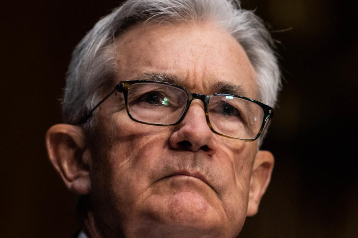 Federal Reserve Chair Jerome Powell listens during his renomination hearing with the Senate Banking Committee on Jan. 11. The Fed is planning to become more aggressive in fighting inflation.