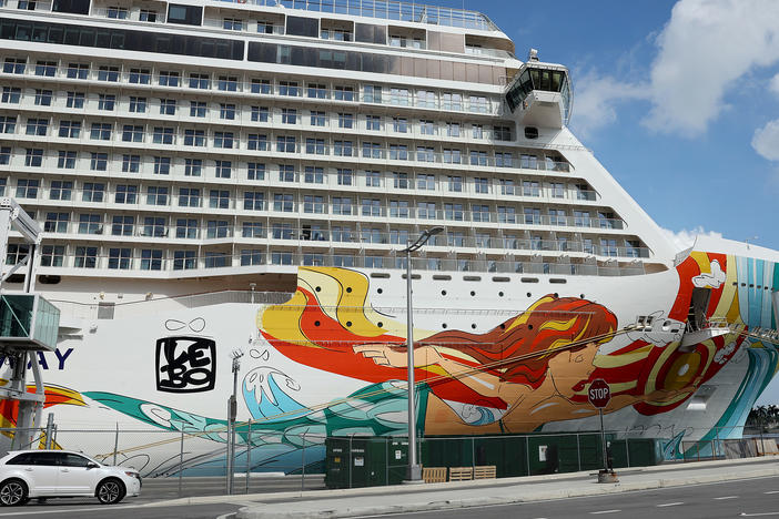 The Norwegian Gateway cruise ship is moored at PortMiami on Jan. 7 in Miami. The Centers for Disease Control and Prevention dropped its advisory warning Wednesday for cruise travel after more than two years of warning Americans.