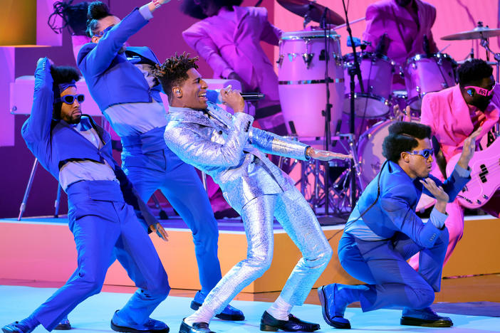 Jon Batiste (center) performs at the 64th annual Grammy Awards on April 3, 2022. Batiste was nominated in 11 categories and took home five prizes, including album of the year.