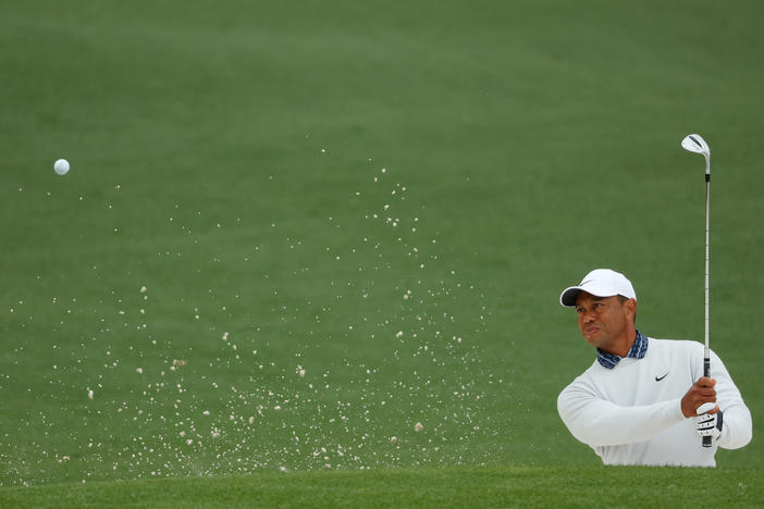 Tiger Woods plays his shot from the bunker on the second hole during the third round of the Masters at Augusta National Golf Club on Saturday.