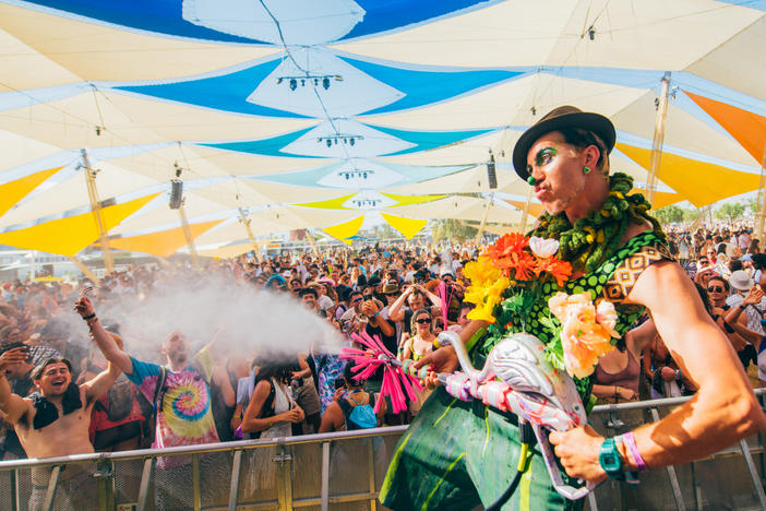 Under the Do LaB's colorful tent, the crowds get doused with water guns.
