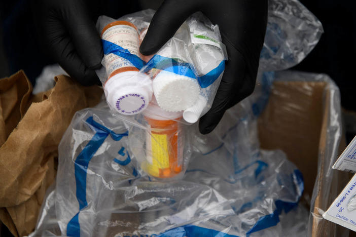 Containers of pills and prescription drugs are boxed for disposal during the Drug Enforcement Administration's 20th National Prescription Drug Take Back Day on April 24, 2021. Nearly 108,000 people died in 2021 from drug overdoses.