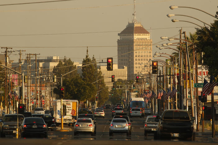 Traffic on a hazy evening in Fresno, Calif. A new study estimates that about 50,000 lives could be saved each year if the U.S. eliminated small particles of pollution that are released from the tailpipes of cars and trucks, among other sources.