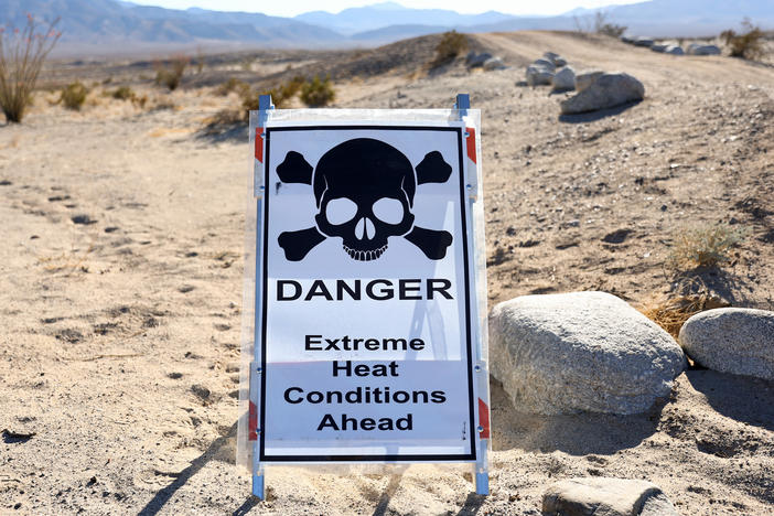 A sign reads "Danger Extreme Heat Conditions Ahead" in Anza-Borrego Desert State Park, which is threatened by climate change, on March 23 near Borrego Springs, Calif.