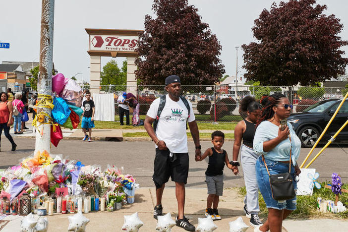Community members gather May 21 to support each other near the Tops market that was targeted in a racist mass shooting in Buffalo, N.Y.
