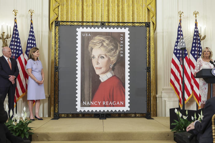 First lady Jill Biden (right) speaks onstage with Postmaster General Louis DeJoy and Anne Peterson, former first lady Nancy Reagan's niece, at the unveiling of the Nancy Reagan stamp at the White House on Monday.