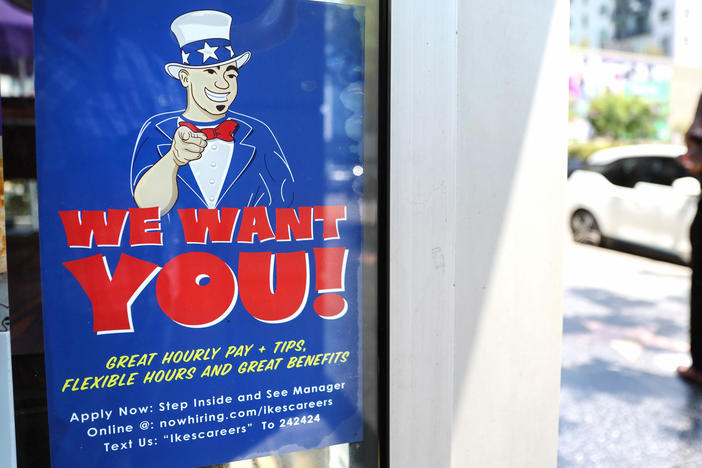 A 'We Want You!' sign is posted at an Ike's Love & Sandwiches store in Los Angeles on July 26.