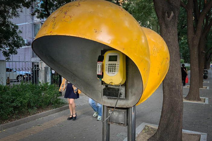 In July, this Beijing payphone began ringing. Who was calling?