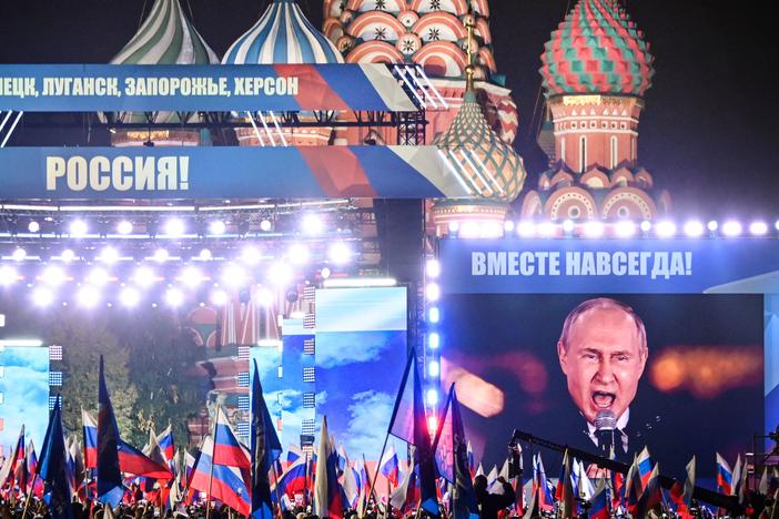 Russian President Vladimir Putin is seen on a screen set at Red Square in Moscow on Sept. 30, as he addresses a rally marking the annexation of four regions of Ukraine occupied by Russian troops: Lugansk, Donetsk, Kherson and Zaporizhzhia.
