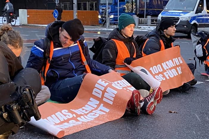 Climate activists from the group Letzte Generation (Last Generation) hold up commuter traffic on a Monday morning in Berlin by supergluing themselves to the road. Police unstick their hands using cooking oil and a pastry brush while irate drivers look on, stuck for more than an hour.