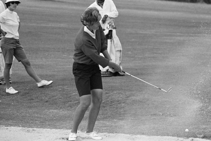 Kathy Whitworth blast out of a sand trap during the Women Titleholders Golf Tournament at Augusta, Ga., on Nov. 25, 1966. Whitworth, whose 88 victories are the most by any golfer, died on Saturday at age 83.