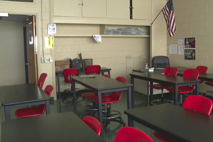 In this image made from video, an empty classroom is shown at David Ellis Academy in Detroit on Feb. 8, 2021.
