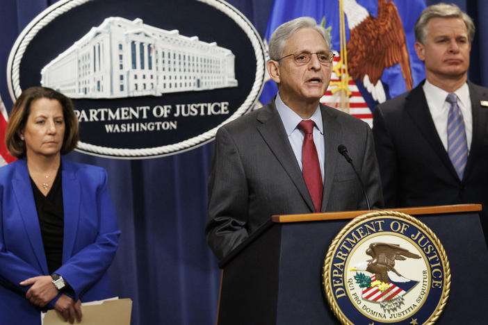 U.S. Attorney General Merrick Garland speaks during a news conference with Deputy Attorney General Lisa Monaco (left), and FBI Director Christopher Wray at the Department of Justice in Washington on Thursday.