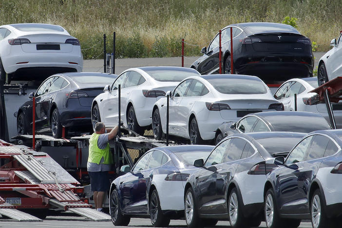 Tesla cars are loaded onto carriers at the automaker's plant in Fremont, Calif., on May 13, 2020. The company is recalling nearly 363,000 vehicles with its "Full Self-Driving" system.