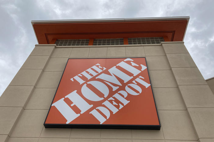 A Home Depot logo sign hangs on its facade on May 14, 2021, in North Miami, Fla. Home Depot reported its financial earnings on Tuesday.