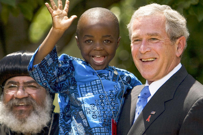 In 2003, President George W. Bush created PEPFAR to help countries tackle the HIV/AIDS crisis. Four years later, he spoke at the Rose Garden to urge lawmakers to set aside $30 billion for the cause over the next 5 years. Joining him were Kunene Tantoh of South Africa and her 4-year-old son (pictured). Tantoh, who is HIV-positive, coordinated a U.S.-funded mentoring program for mothers with HIV.