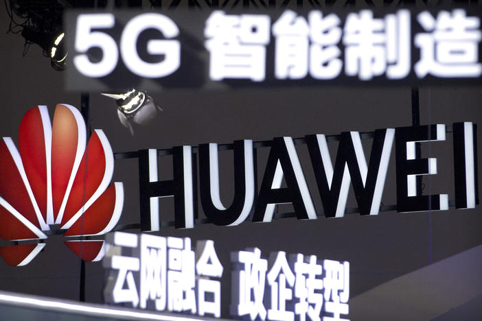 Signs promoting 5G wireless technology from Chinese technology firm Huawei are displayed at the PT Expo in Beijing in 2018. Germany is reviewing the presence of Huawei and ZTE components in its telecommunications.