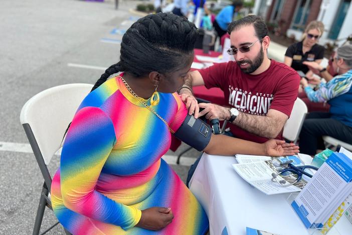 Substitute teacher Crystal Clyburn, 51, doesn't have health insurance. She got her blood pressure checked at a health fair in Sarasota, Fla.