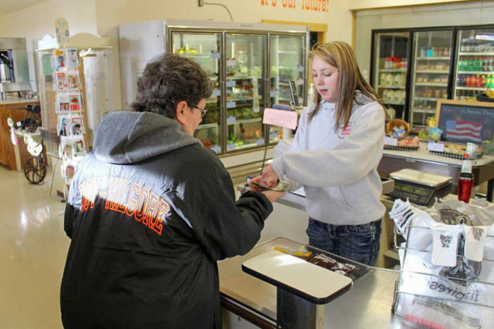 Students help run the Circle C Market in rural Cody, Neb., as part of classwork. As rural areas struggle to keep traditional grocery stores, some communities are finding innovative ways to keep the stores running.