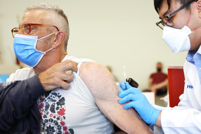 Student pharmacist Charles Liu administered a dose of mpox vaccine at a Los Angeles County Department of Public Health clinic in West Hollywood, Calif., last August.