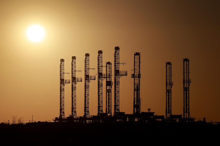 Drilling rigs sit unused on a lot in Odessa, Texas, in the Permian Basin, in March 2022. U.S. oil companies are thriving as they look to avoid the boom-and-bust cycles of the past. That has big implications, including for consumers and global producers.