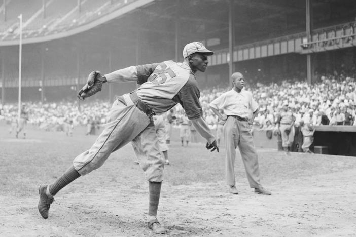 Kansas City Monarchs pitching great Satchel Paige warms up at New York's Yankee Stadium Aug. 2, 1942 for a Negro League game between the Monarchs and the New York Cuban Stars.