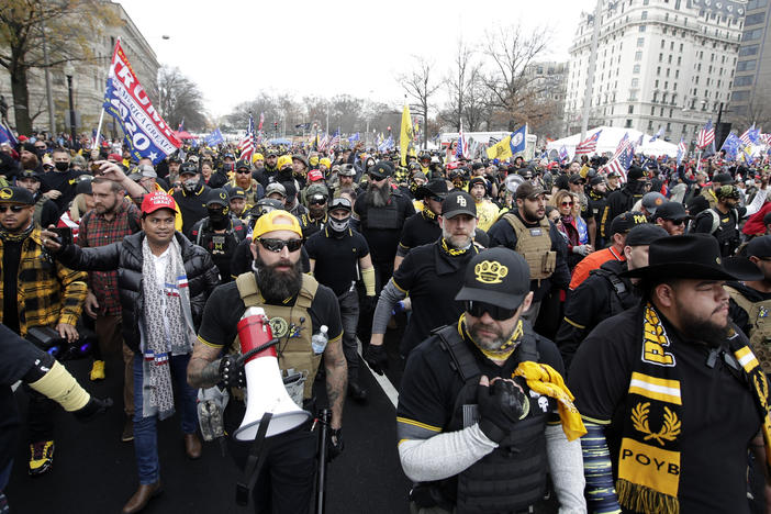 Supporters of President Donald Trump wearing attire associated with the Proud Boys attend a rally at Freedom Plaza, Dec. 12, 2020, in Washington. A judge on Friday awarded more than $1 million to a Black church in downtown Washington that sued the far-right Proud Boys for tearing down and burning a Black Lives Matter banner during a 2020 protest.
