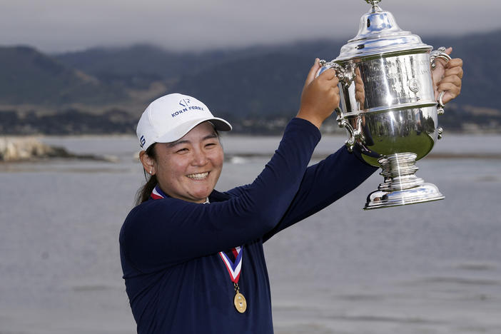 Allisen Corpuz poses with the winner's trophy after the U.S. Women's Open golf tournament at the Pebble Beach Golf Links, Sunday, July 9, 2023, in Pebble Beach, Calif.