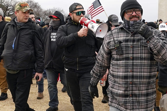 Proud Boys members including Zachary Rehl, left, Ethan Nordean, center, and Joseph Biggs, walk toward the U.S. Capitol in Washington, in support of President Donald Trump on Jan. 6, 2021.