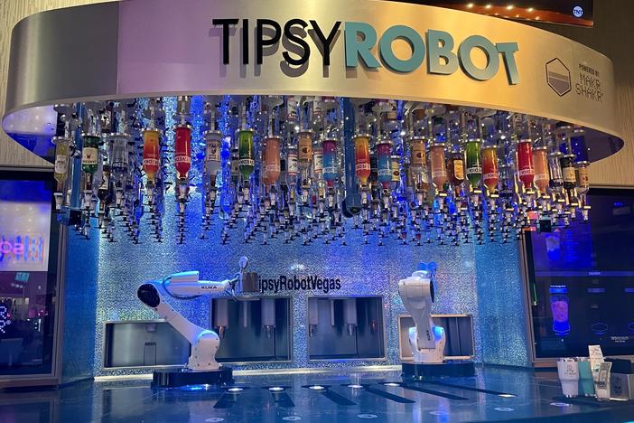 This bar inside Planet Hollywood on the Las Vegas strip has two robots that serve customers drinks. The Tipsy Robot opened a second location on the strip this year.
