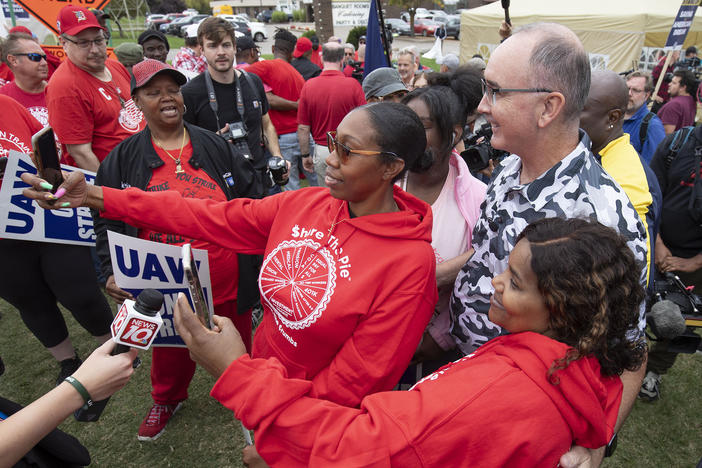 United Auto Workers President Shawn Fain posed with UAW members as they strike the General Motors Lansing Delta Assembly Plant in Michigan in late September.